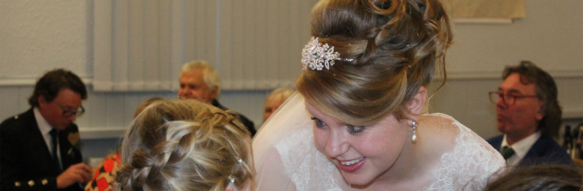 Bride and bridesmaid hair at wedding